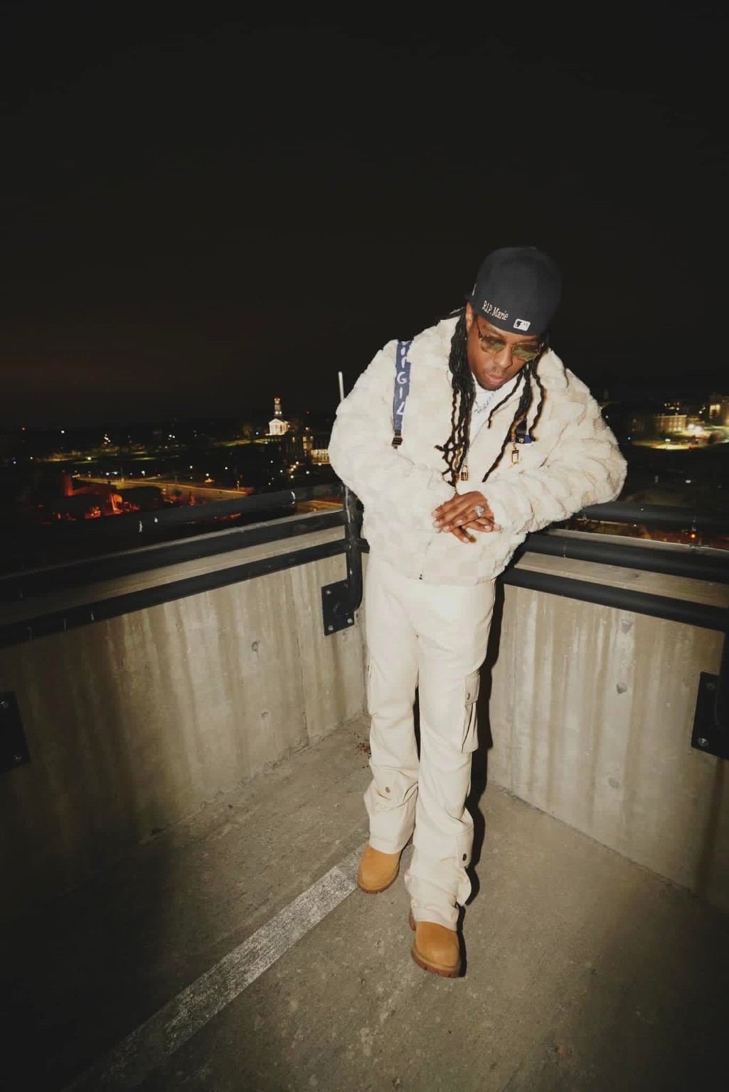 A1 Flow wearing white in a rooftop night portrait